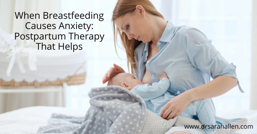 Mom looking stressed when breastfeeding newborn baby